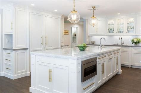 We did not find results for: Stunning white kitchen with brass accents features a ...