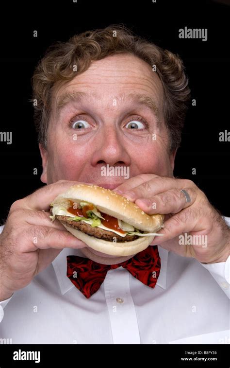 Man Eating A Burger Stock Photo Alamy