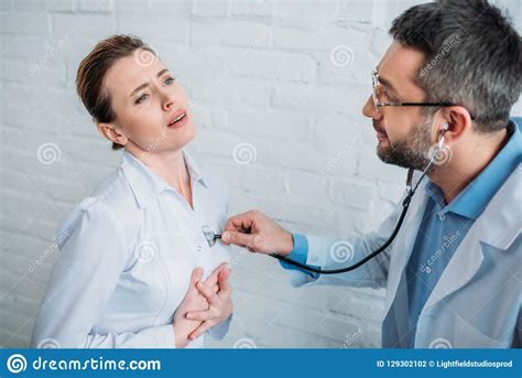 Doctor Listening To Heartbeat Of Patent Stock Photo Image Of Painful