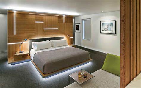 Modern wooden platform bed with shelving underneath: 9 Examples Of Beds With Hidden Lighting Underneath ...