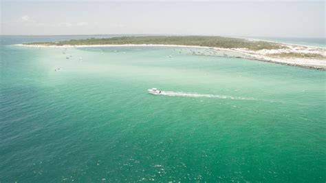 (the inlet eventually filled in 1965, connecting the two separate islands into one.) Shell Island Shuttle | Panama City, FL 32408