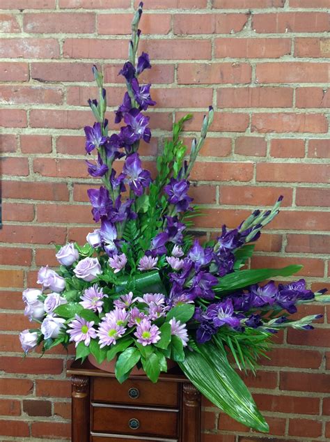For more traditional services, white bouquets and funeral sprays are a choice that is bound to bring feelings of hope, comfort, and peace. Purple glads, lavender daises and roses. Manly colors but ...
