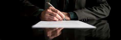 Wide Cropped View Of A Businessman In Business Suit Signing Contract