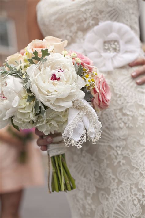 Look and feel like a princess with an elegant and affordable wedding dress from our collection of over 100. Bridal bouquet wrapped in grooms mother's wedding gown ...