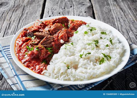Beef Stew With Rice On A White Plate Stock Image Image Of Meal Delicious