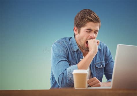 Sleepy Man Yawning While Working On Laptop Stock Photo Image Of