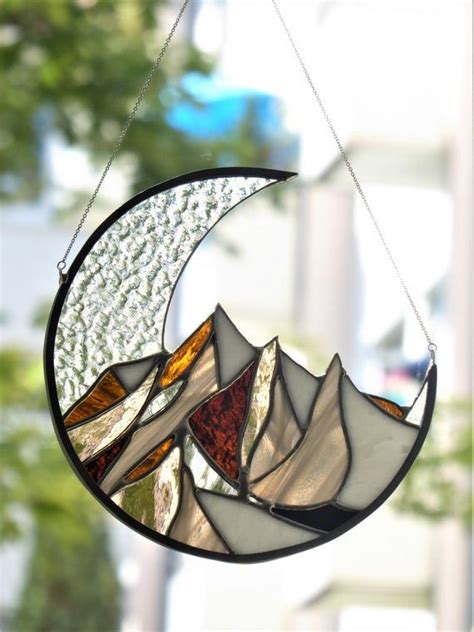 In traditional stained glass, these are the thick black lines that outline the graphics. Stained glass window hangings suncatcher. Nordic mountains ...