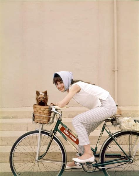 Audrey Hepburn Riding Her Bike On A Hollywood Backlot During The