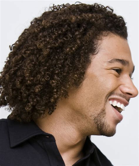 This cool cut for black hair extends the hairline into an arced part that also divides long hair from some of the best men's haircuts combine contrasts, like this cool taper fade with long twists. Corbin Bleu Medium Curly Afro Hairstyle
