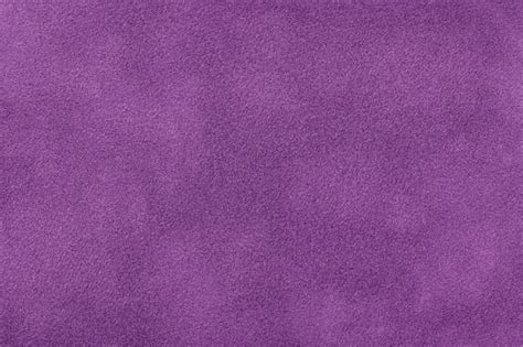 Fondo mate púrpura oscuro de tela de gamuza primer plano textura de