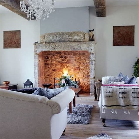 The days are getting shorter and the evenings discernibly colder. Country living room with open fire | Living room design ...