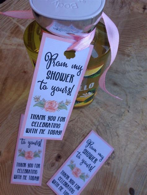 Use a glue stick and apply glue on the back side of the tag. From my shower to yours, bath bomb,soap, shower favor ...