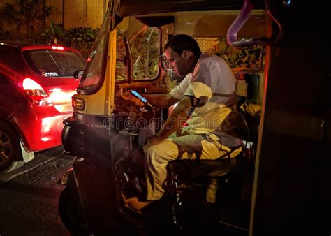 Auto Driver Using Phone In Traffic In India Editorial Stock Photo