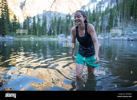 Young Woman Wading Through Lake The Enchantments Alpine Lakes