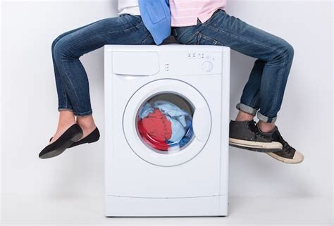 Premium Photo Young Couple Are Sitting On The Washing Machine