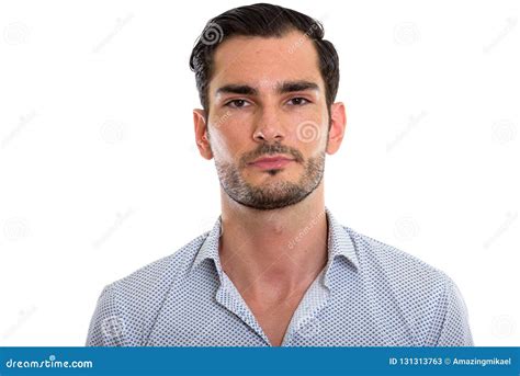 Studio Shot Of Young Handsome Businessman Looking At Camera Stock Image