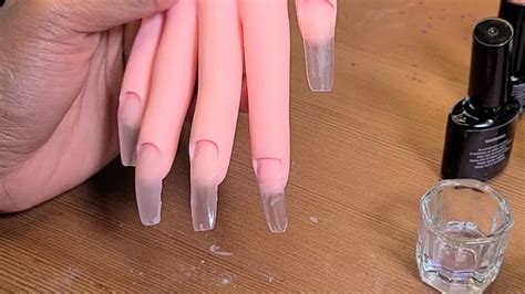 Doing Acrylic Nails For The First Time On A Practice Hand ... While nail salons are closed, here's how to remove acrylic nails yourself safely at home.