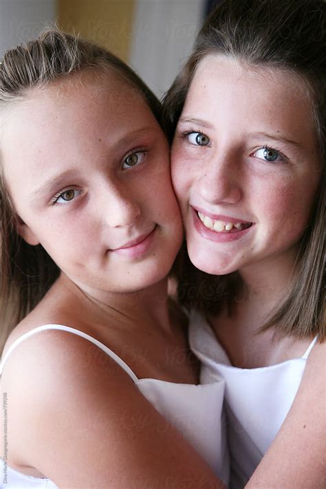 Two Young Girls Cheek To Cheek In White Dresses By Dina Marie Giangregorio