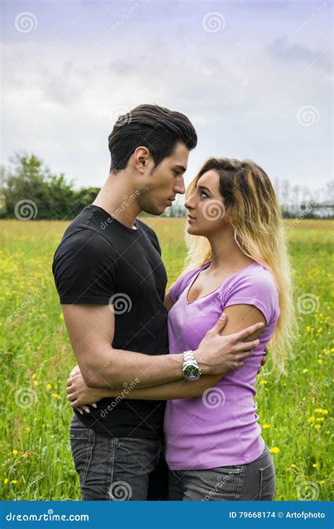 Boyfriend And Girlfriend Standing Showing Romantic Love Stock Photo