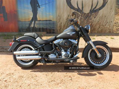 From front to back, this custom cruiser shows attitude, with custom, black bullet hole wheels, a denim black frame. Harley-Davidson FLSTFB Fat Boy Lo: pics, specs and list of ...