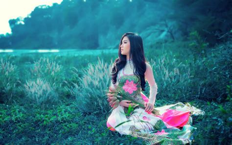 asian model women long hair brunette flowers grass trees bushes traditional clothing shore