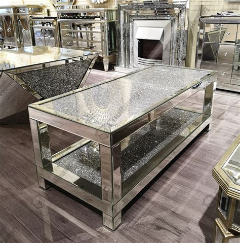 The new classy mirrored glass coffee table is inlaid with diamond crushed glass crystals that give a sparkling look. Morden luxury sparkle crushed glass diamond coffee table