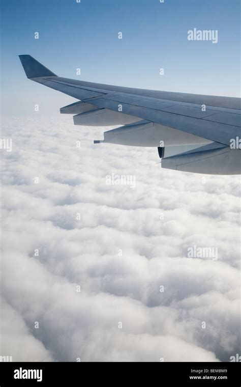 An Airplane Wing Above Clouds The Airplane Is Airbus A340 Operated By