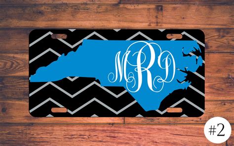 A Black And Blue License Plate With The State Of North Carolina On Its