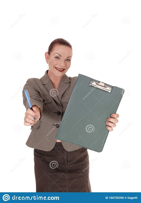Smiling Woman Holding Her Clipboard And Pen Stock Photo Image Of