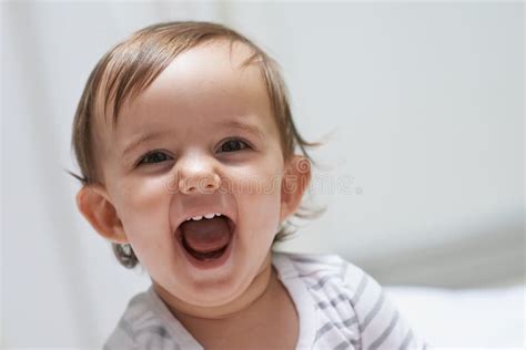 Thats So Funny Portrait Of An Adorable Baby Girl Laughing Stock Image
