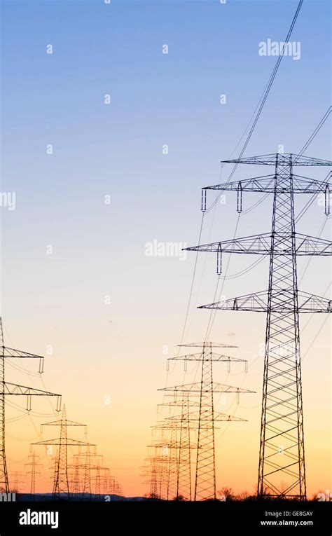 High Voltage Power Lines Pylon Sunset Energy Stock Photo Alamy