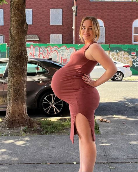 Massive Pregnant Blonde Straining Her Dress Belly By