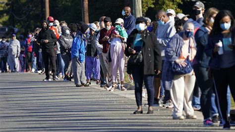 Long Lines Form As North Carolina Begins Early Voting