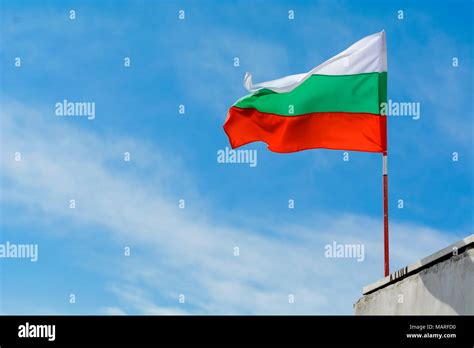 Bulgarian Flag Waving Against Vibrant Blue Sky Stock Photo Alamy