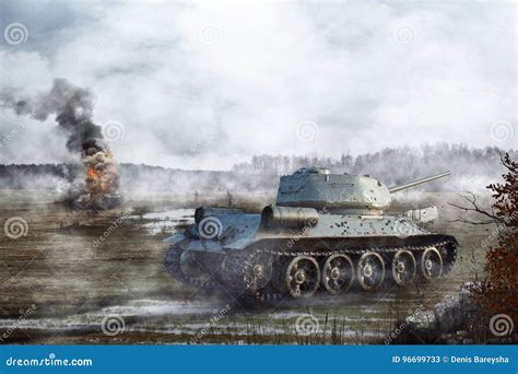 Soviet Tank Goes Through The Swamp In The Background Of A Burning Tank