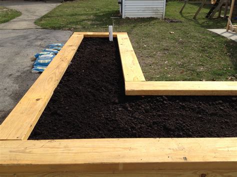 How do i build a raised bed garden? Building a Self Watering Raised Garden Bed - Frugal Living