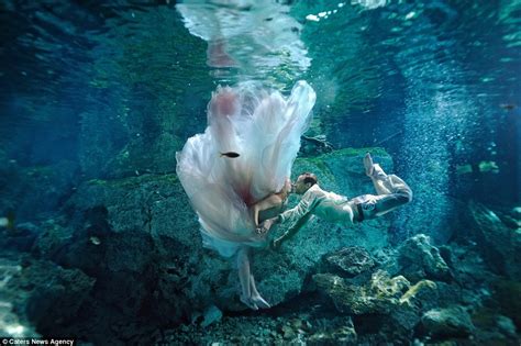 Photographer Pierre Violle Captures Brides Diving Underwater For Trash