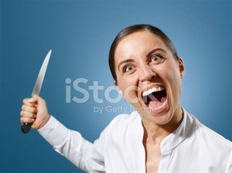 Angry Businesswoman With A Knife Stock Photo Royalty Free Freeimages