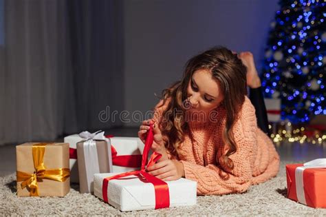 Beautiful Woman Opens Ts At Christmas Tree Holiday New Year Lights