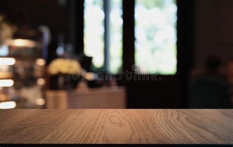 Wood Table Top In Blur Background Room Interior With Empty Copy Space