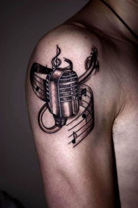 This tattoo has infinity music symbol that mixes well with the overall tattoo design. sexy tattoos for men | Microphone Music Tattoo Design For ...