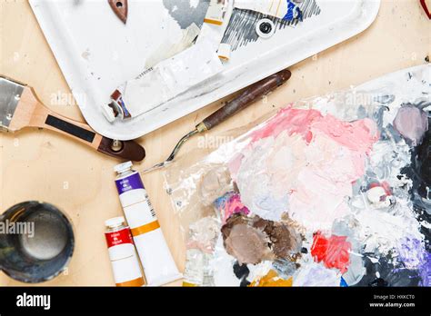 Artist Table With Paints Brushes Stock Photo Alamy