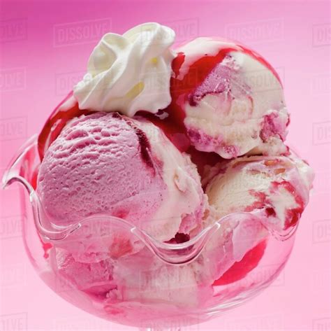 Raspberry And Vanilla Ice Cream With Raspberry Sauce And Cream Close