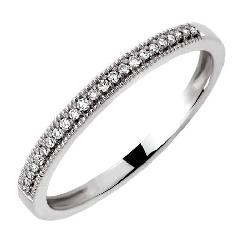 The exchange of wedding bands has long signified the commitment of matrimonial partnership. Wedding Band with Diamonds in 10kt White Gold