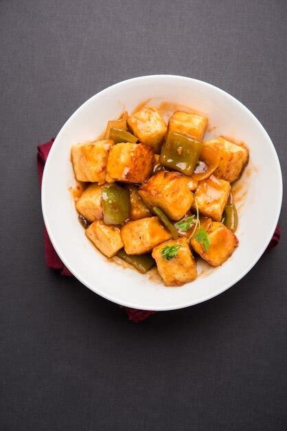Premium Photo Chilli Paneer Or Spicy Cottage Cheese Served In White