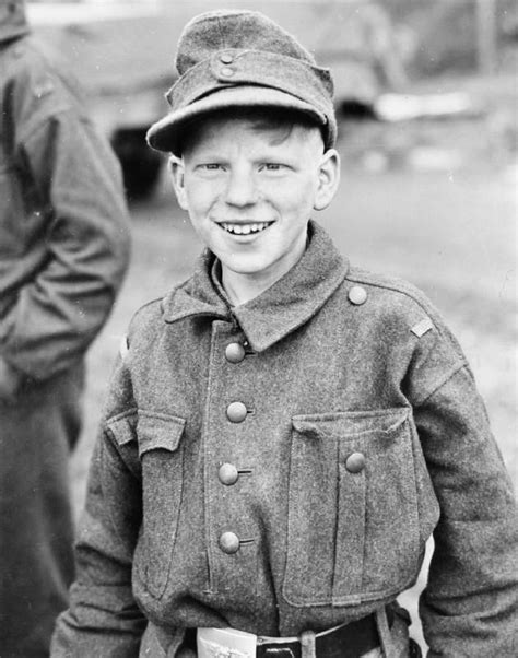 A Cheerful Young German Boy Soldier Captured By The 11th Armored