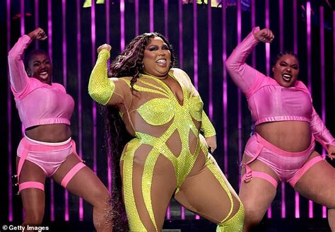Lizzo Stuns In A Glittery Neon Yellow Nude Illusion Bodysuit As She