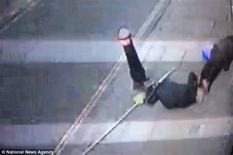cctv caught moment two women were struck by falling scaffolding pole in london daily mail online