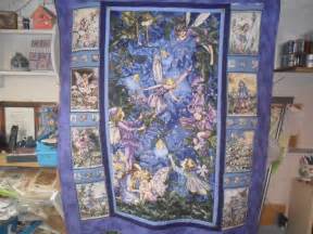 One large flower panel cut into 4 with simple borders makes a beautiful radiant quilt. Fairy Quilts for my DGDs