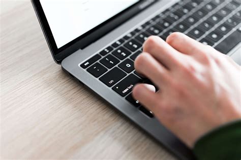 Freelance Man Typing On His Laptop Close Up Free Stock Photo Picjumbo
